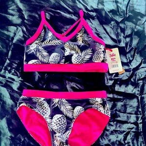 Girls black & fuchsia REVERSIBLE 2 piece bathing suit by Justice. $10